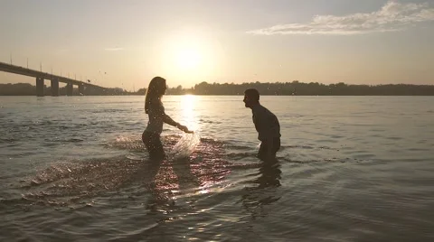 Two young people in love having fun with water Stock-Footage 68060374