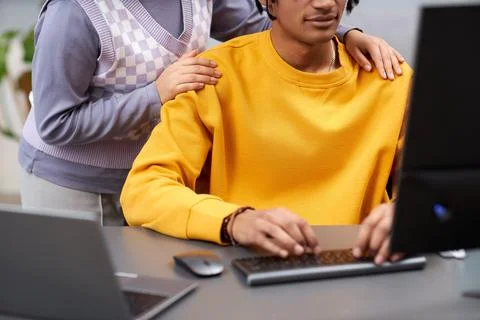 Two young people reviewing code together Stock Photos