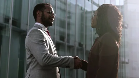 Two young people shaking hands outdoor Video stock 114964436