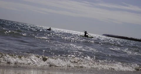 Two Young People on Stand up Paddle Board on beach in Alicante, Spain Stock Footage 145675941