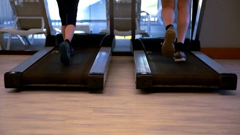 Two young people working out on treadmills Stock Footage 108107527