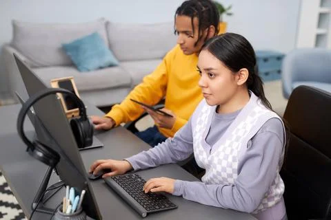 Two young people writing code in office woman in foreground Stock Photos