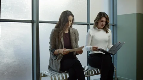 Two Young Professionals Wait For Job Interview, One Woman Gets Called In Video stock 97258890