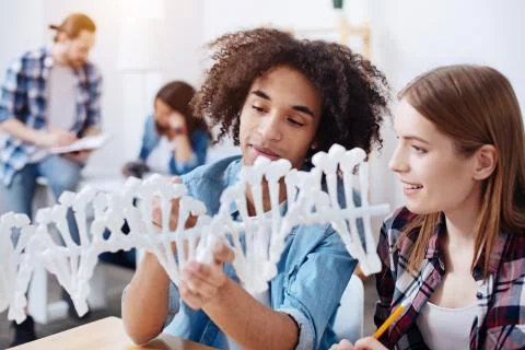 Two young scientists exploring structure of human genome together 스톡 사진