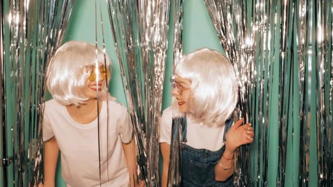 Two young sexy smiling hipster girls in white wigs and red lips Stock Footage 142207316