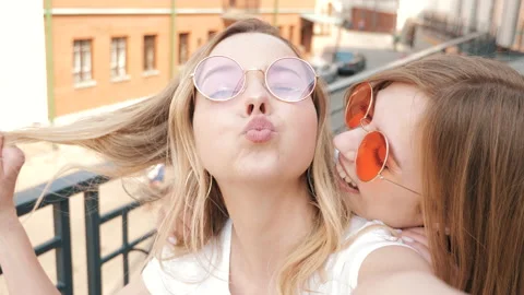 Two young smiling hipster blond women in summer Stock Footage 141243840