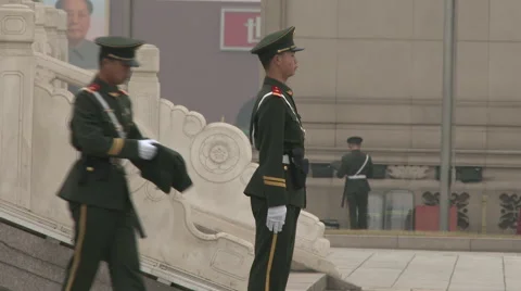 Two young soldiers stand guard at the base of Monument to the People, 4K. Stock Footage 67890165