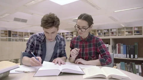 Two young students are learning together... | Stock Video | Pond5