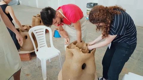 Two young students working on a sculpture at the 12th International Eskisehir Stock Footage 104032115