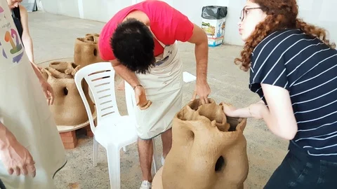Two young students working on a sculpture at the 12th International Eskisehir Video stock 104032144