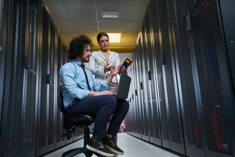 Two young technicans working Stock Photos