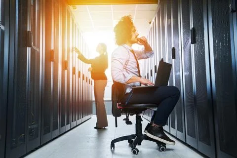 Two young technicans working Stock Photos