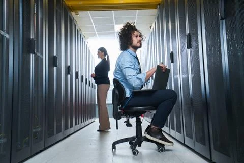 Two young technicans working Stock Photos