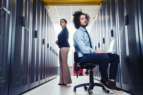 Two young technicans working Stock Photos