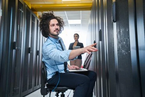 Two young technicans working Stock Photos