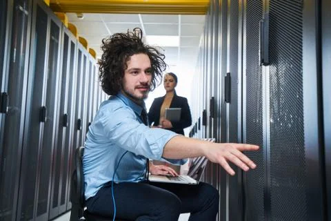 Two young technicans working Stock Photos