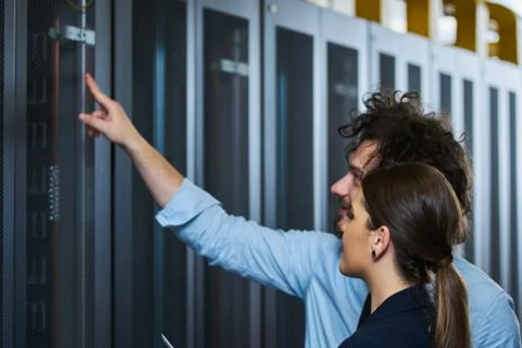 Two young technicans working Stock Photos