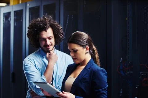 Two young technicans working Stock Photos