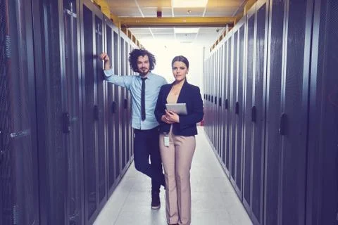 Two young technicans working Stock Photos