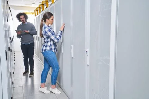 Two young technicans working Stock Photos
