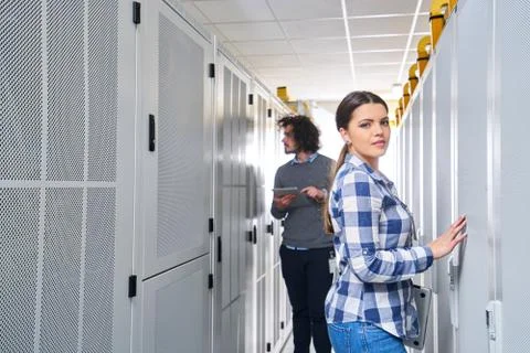 Two young technicans working Stock Photos