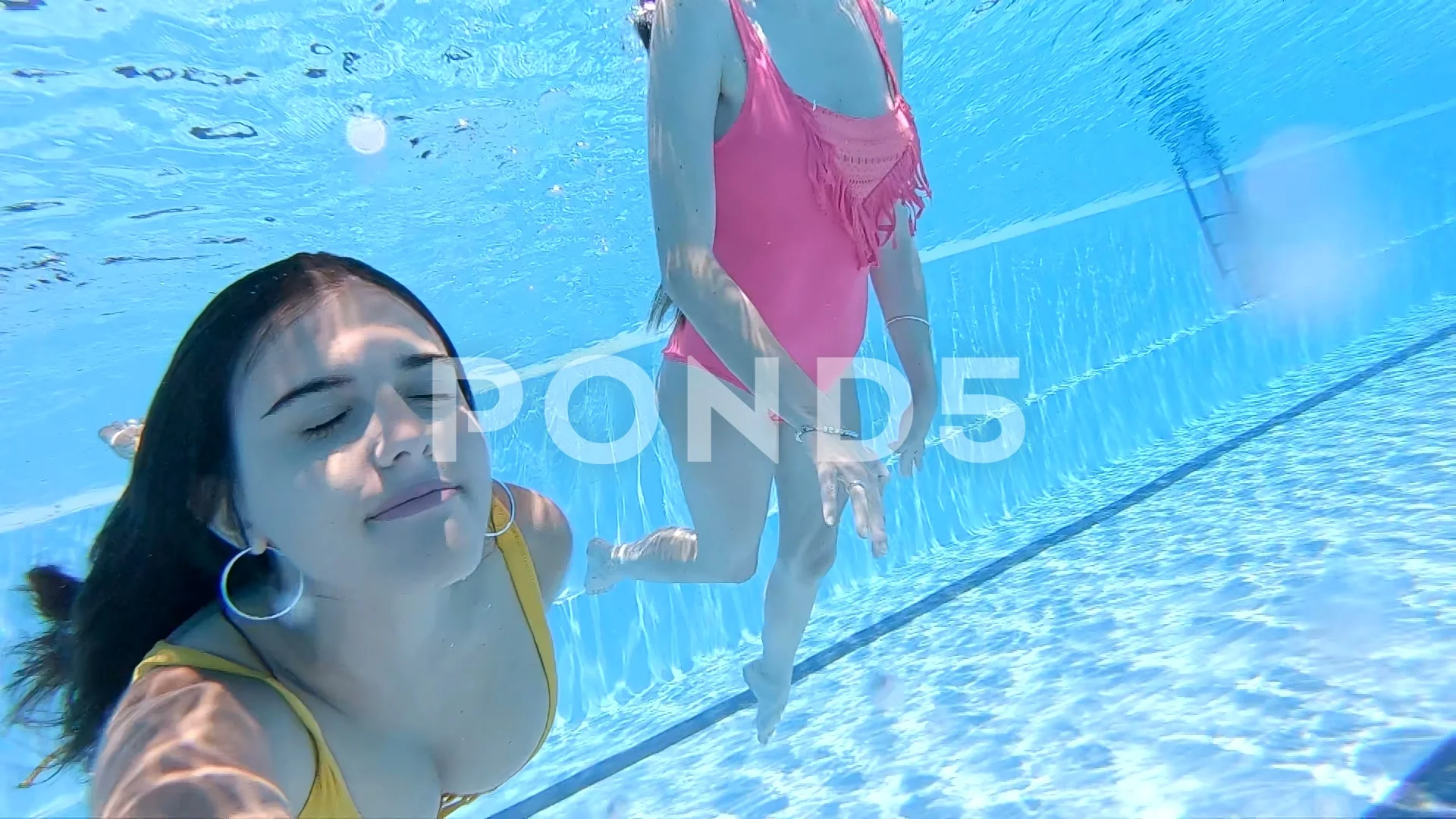 Two Young Women Having Fun On Swimming Pool Stock Photo - Download