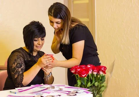 The two young womans working in office Stock Photos