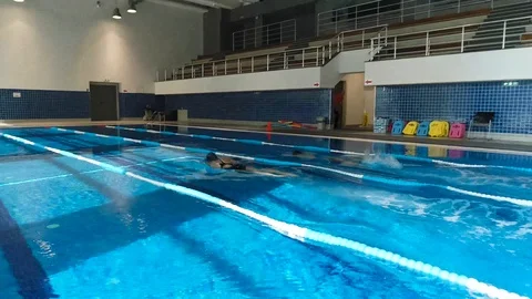 Two young women exercising in a pool, drone footage aerial view, jb01 Stock Footage 103303339