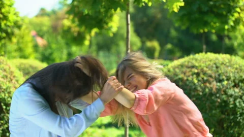 Two young women fighting pulling hairs of each other, female conflict, quarrel Video stock 115316737