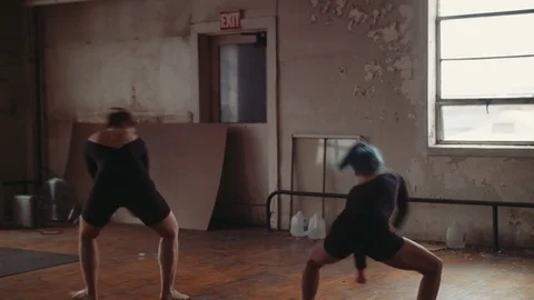 Two Young Women Practice A Dance in Unison Stock Footage 81631802