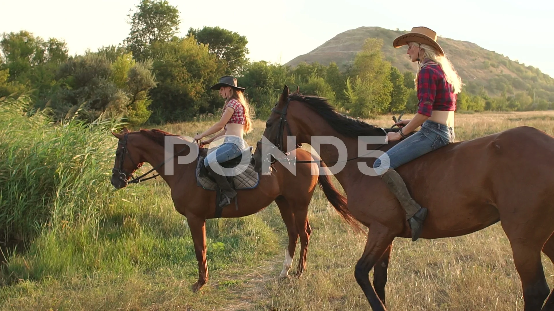 Women store riding horses