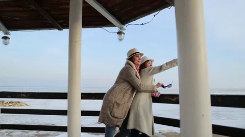 Two young women standing on the lighthouse. travel and leisure Vídeos de archivo 75390650