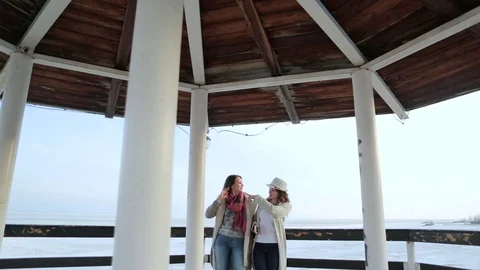 Two young women standing on the lighthouse. travel and leisure Stockbeeldmateriaal 75445423