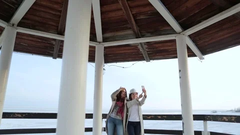 Two young women standing on the lighthouse. travel and leisure 库存影片 75445545
