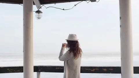 Two young women standing on the lighthouse. travel and leisure Stock Footage