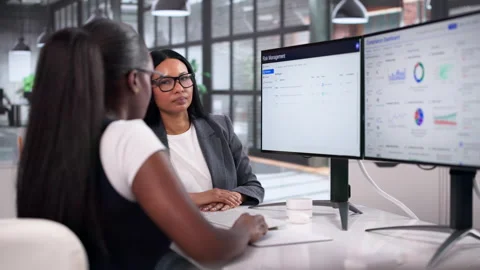 Two Young Women Using Computer Stock Footage 334527955