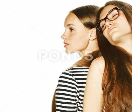 Two young workers isolated on white, same dresses in strip Stock Photos