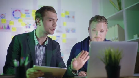 Two young workers violently discuss the new project Stock Footage 62549925