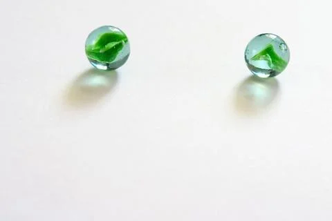 Two zero round glass marbles on white background Stock Photos