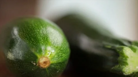 Two Zucchini Focus Orbits them Closeup Stock Footage 99166476