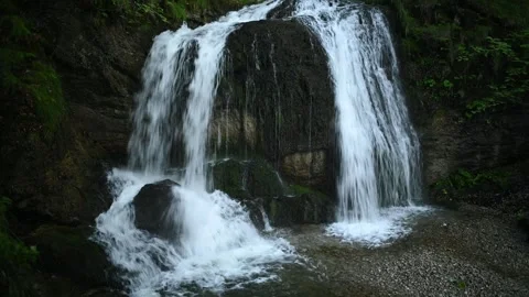 A twofold waterfall hidden in a forest Stock Footage 260934100