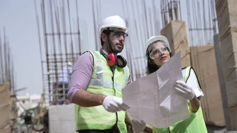 TwoIndian engineers holding drawing work on construction site. 動画素材 162014286