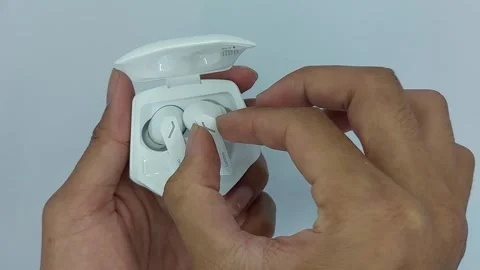 Tws or white lenovo wireless bluetooth earphones for listening to music Stock Footage 245490412