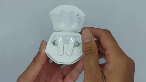 Tws or white lenovo wireless bluetooth earphones for listening to music Stock Footage 245492223