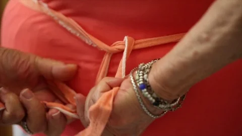 Tying Apron Strings Stock Footage 75212722