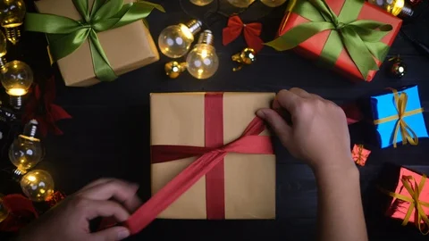 Tying Up Christmas Present. Top View Stock Footage 97255402