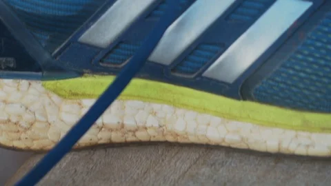 Tying laces of runing shoes Stock Footage 107325685
