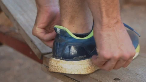 Tying laces of running shoes Stock Footage 107325683