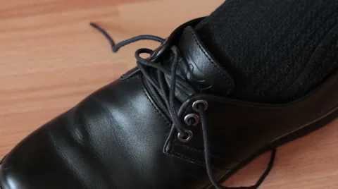 Tying the laces of a shoe. Stock Footage 55713043
