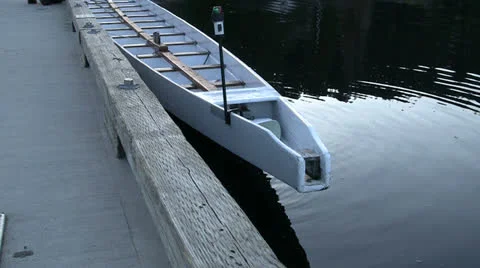 Tying Up Long Canoe For Practice Run Stock Footage 22639914